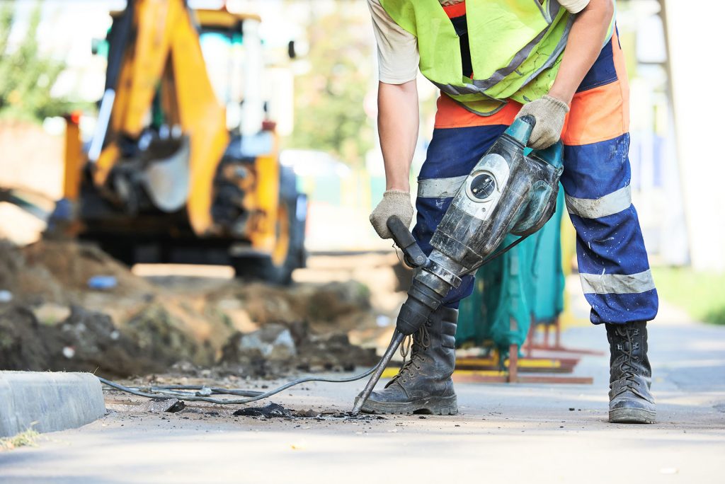 Picture of Builder worker with pneumatic hammer drill